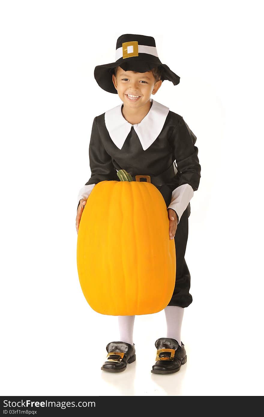 An adorable preschooler dressed as a Pilgrim happily lifting a large pumpkin. Isolated on white. An adorable preschooler dressed as a Pilgrim happily lifting a large pumpkin. Isolated on white.