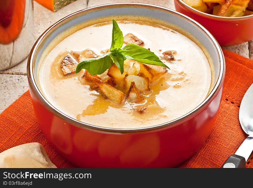 Pumpkin soup with fried potato and croutons