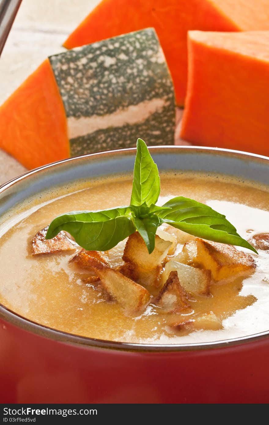 Pumpkin soup with fried potato and croutons