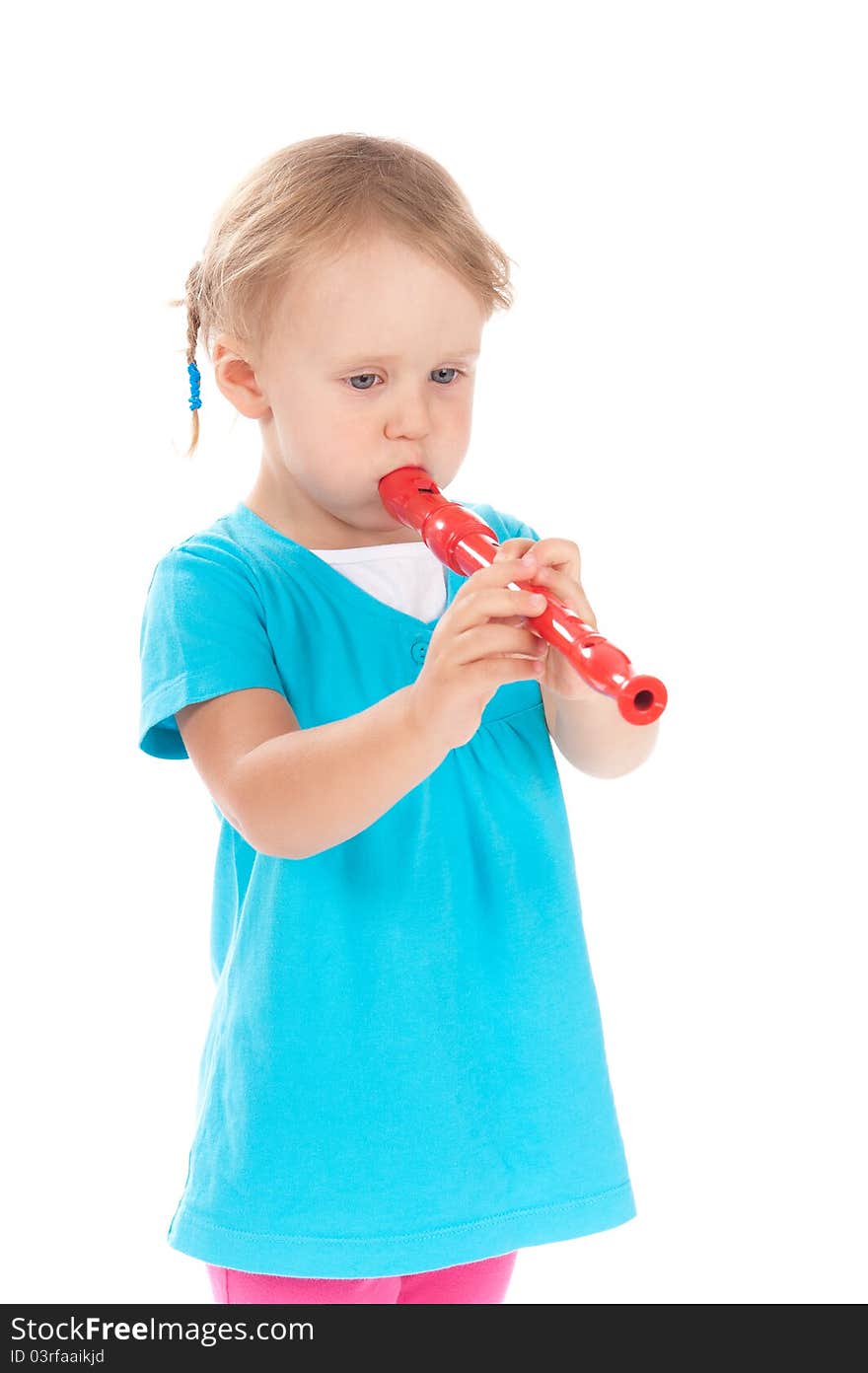 Child in the studio playing the flute