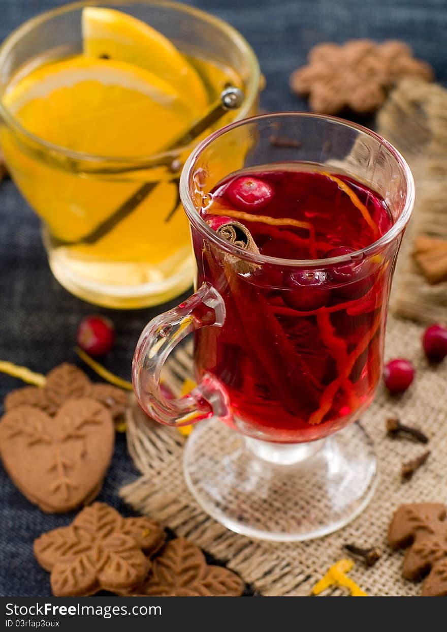 Hot drinks with cranberries and orange. Selective focus