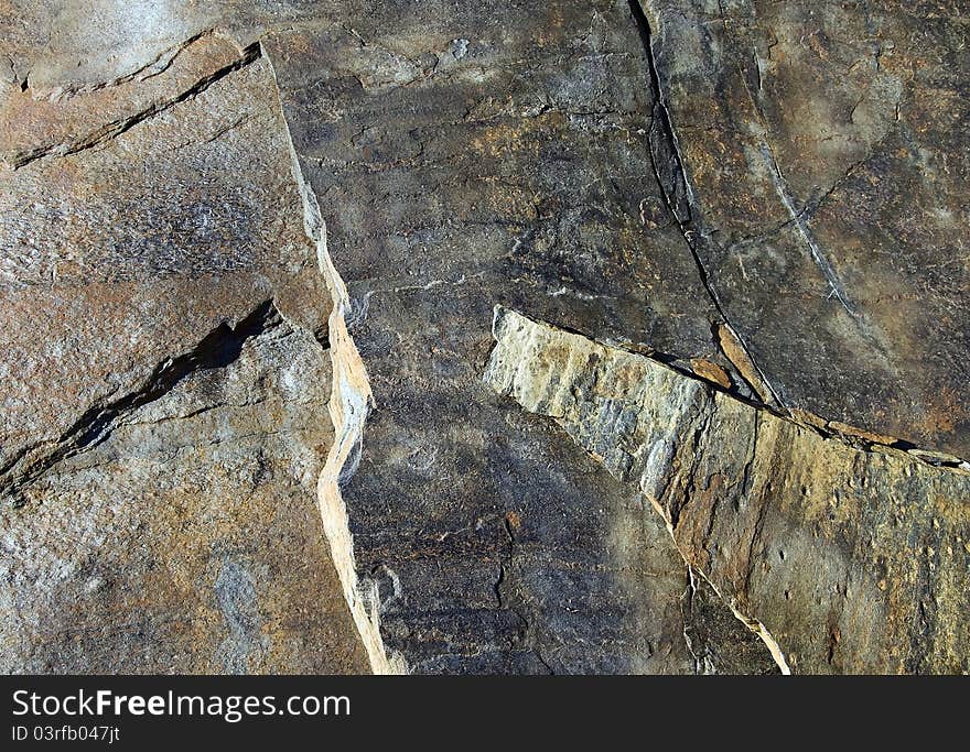 Igneous rock with textures and patterns in a rural scene. Igneous rock with textures and patterns in a rural scene