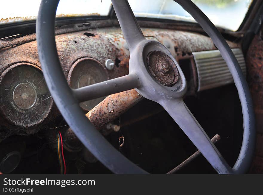 Old dirty and rusted truck steering wheel.