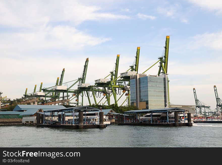 Gigantic Lifting Cranes At A Container Port. Gigantic Lifting Cranes At A Container Port