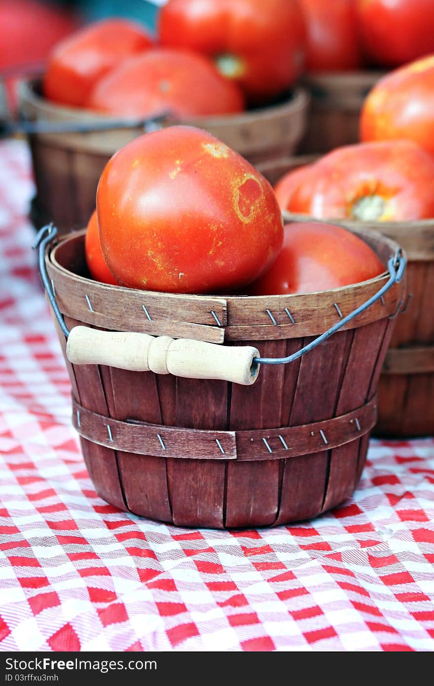 Large tomatoes in brown baskets. Large tomatoes in brown baskets