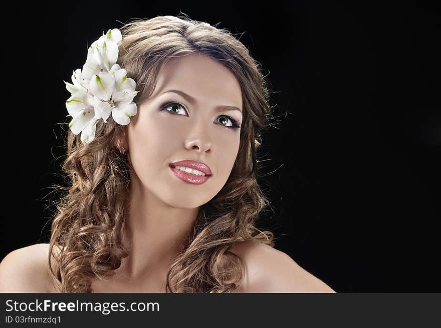 Portrait of beautiful bride with flowers in hair on black. Portrait of beautiful bride with flowers in hair on black