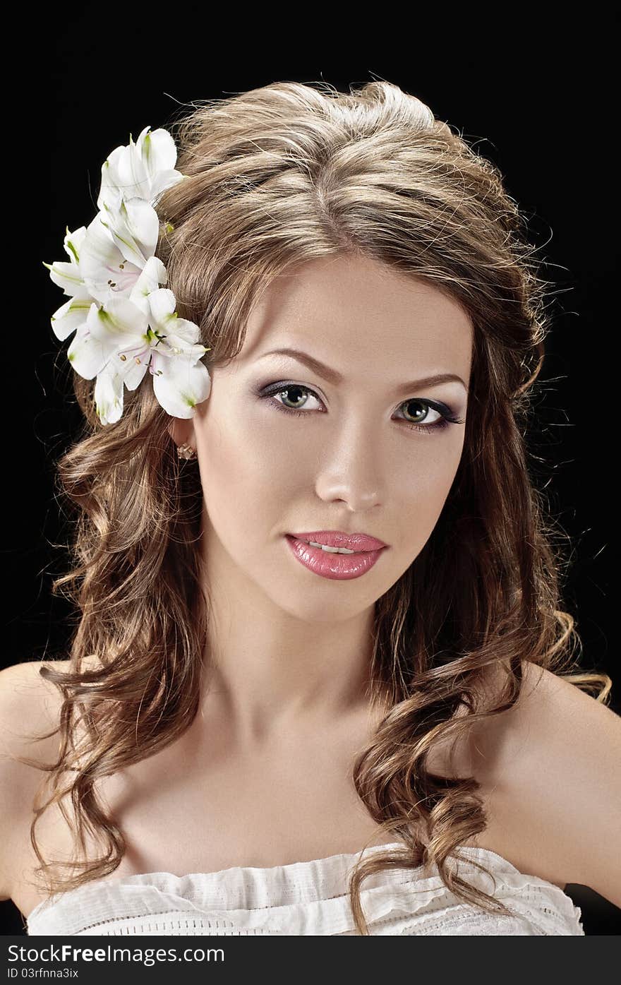 Portrait of beautiful bride with flowers in hair on black. Portrait of beautiful bride with flowers in hair on black