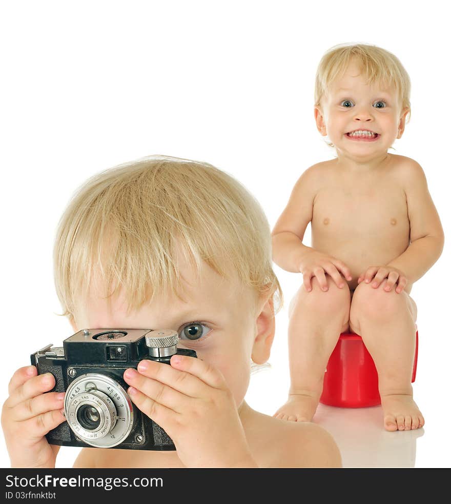 Little boy with old photographic camera and boy on potty on white background. Little boy with old photographic camera and boy on potty on white background