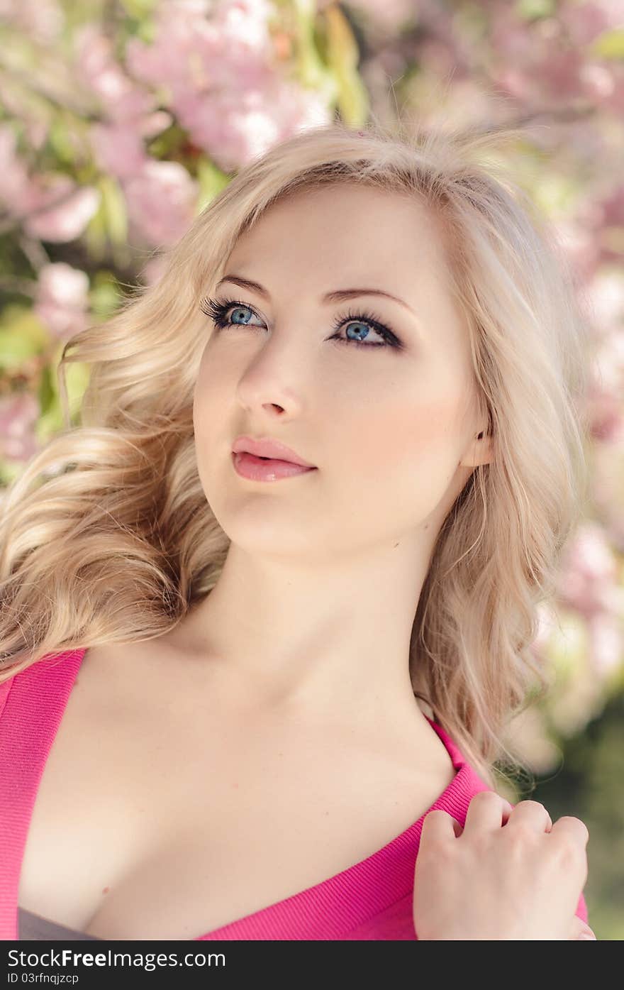 Portrait of beautiful girl with blooming sakura on background. Portrait of beautiful girl with blooming sakura on background