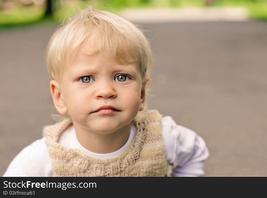 Little sympathetic boy looking at the camera. Little sympathetic boy looking at the camera