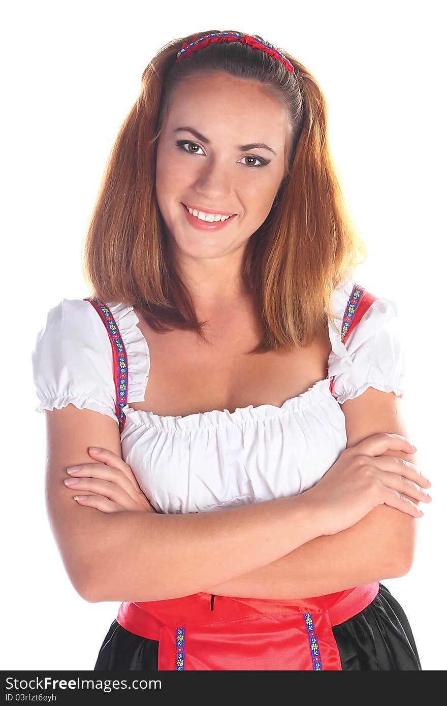 The girl in a traditional Bavarian dress with full glasses of beer in hands