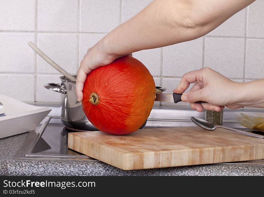 Studio-shot of preparing lunch for the family. cooking pumpkin soup in a modern kitchen. Studio-shot of preparing lunch for the family. cooking pumpkin soup in a modern kitchen.