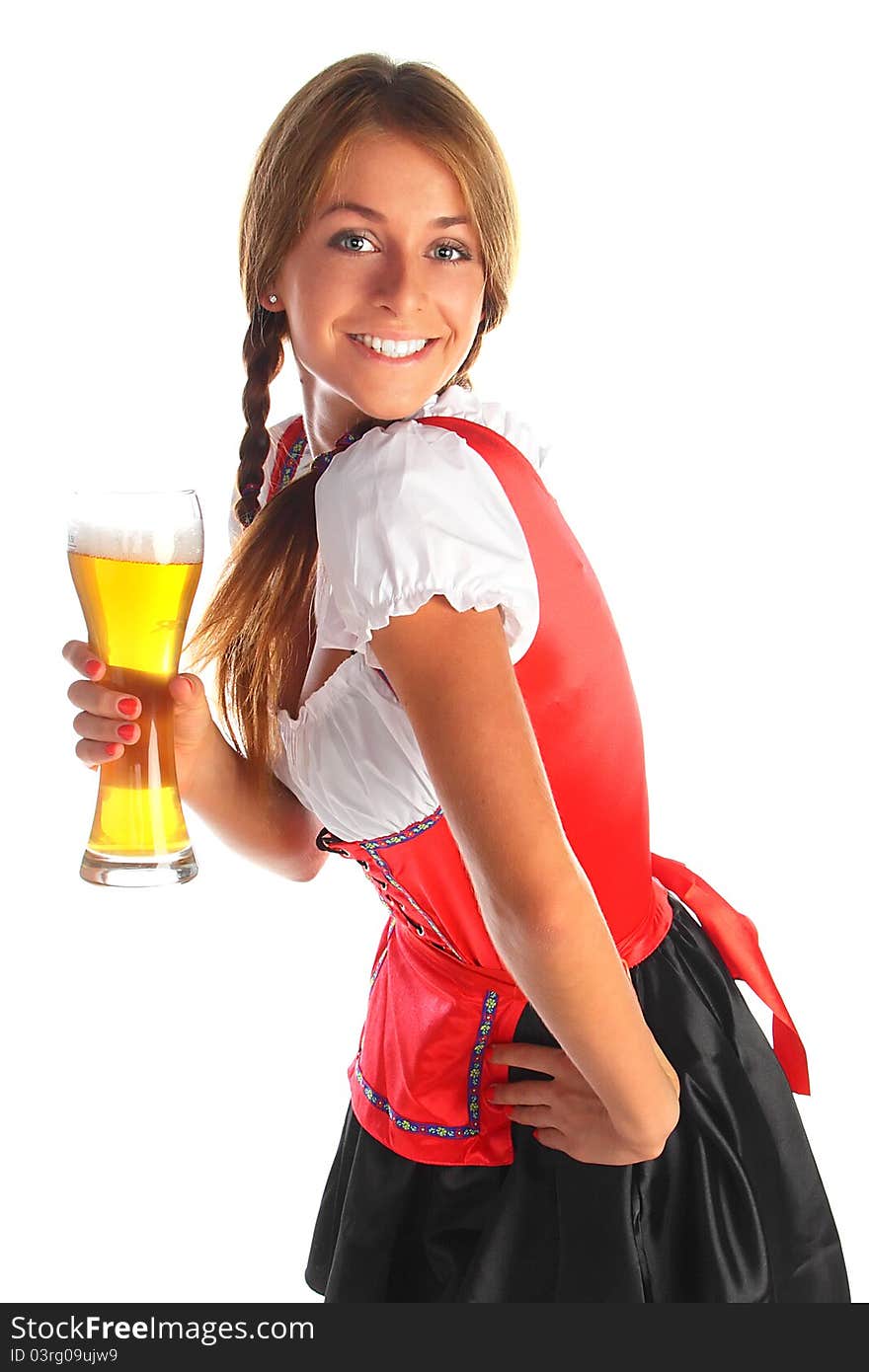 The girl in a traditional Bavarian dress with full glasses of beer in hands