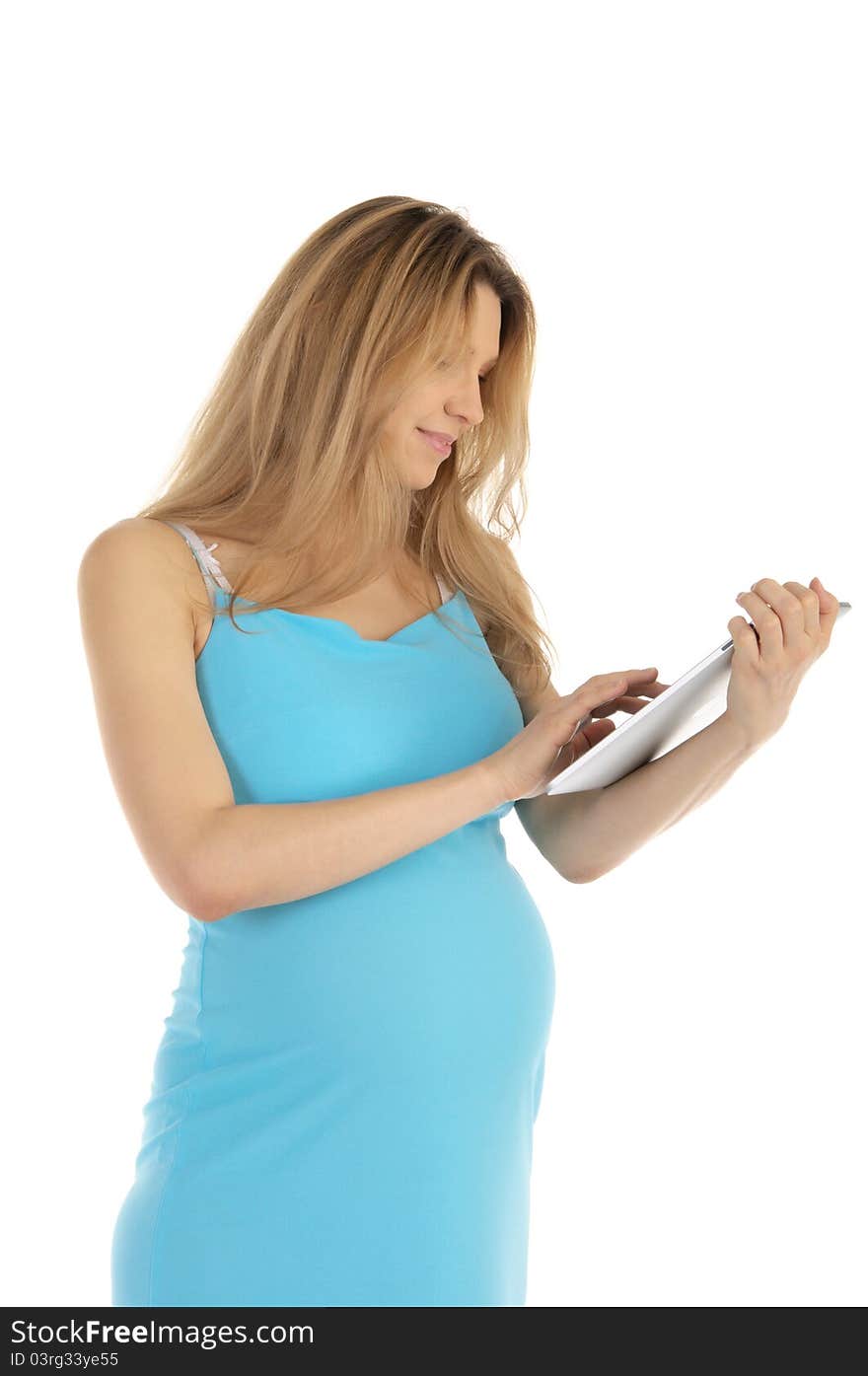 Happy pregnant woman with tablet