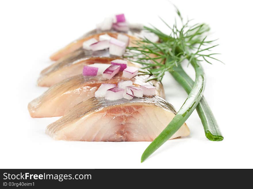 Isolated pieces of salt fillet herring with onion