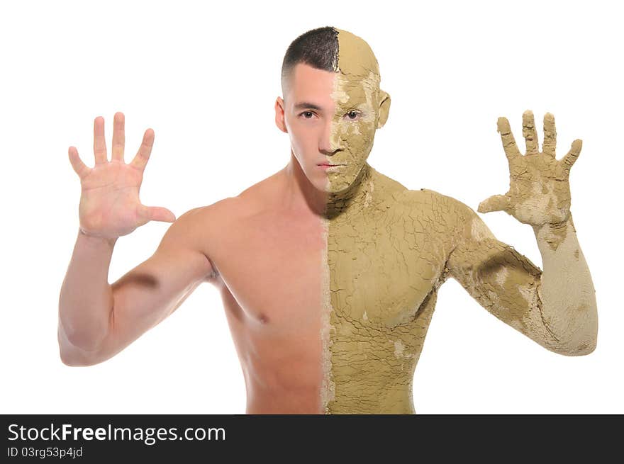 Young man half smeared with clay isolated on white