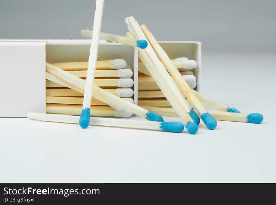 2 box of matches with a blue gray on a white background