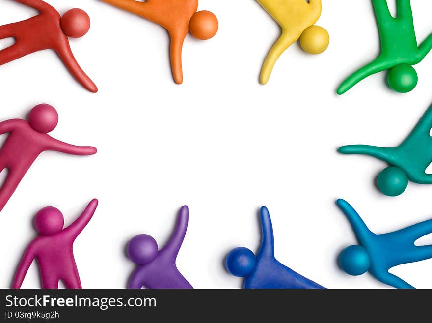 Multicolored plasticine human figures on a white background. Multicolored plasticine human figures on a white background