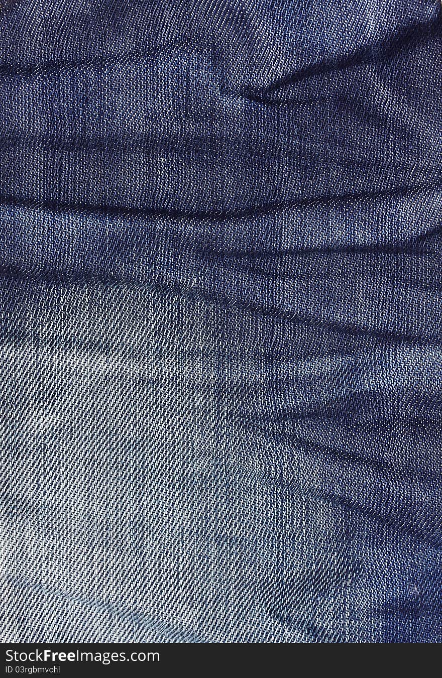 Crease the wrinkled surface of denim pants. Crease the wrinkled surface of denim pants.