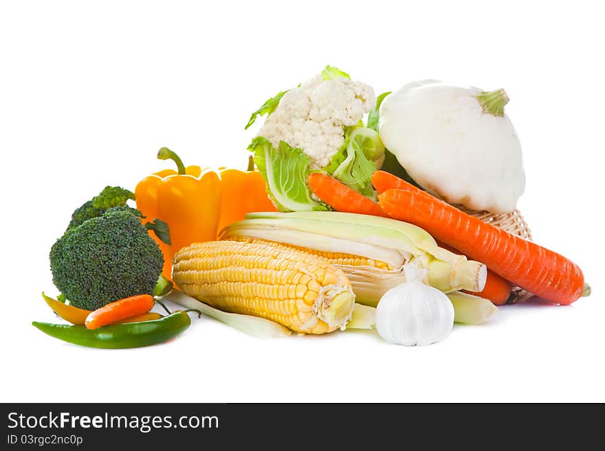 Still-life of autumn harvest with yellow, orange and green colors on isolated white background. Still-life of autumn harvest with yellow, orange and green colors on isolated white background