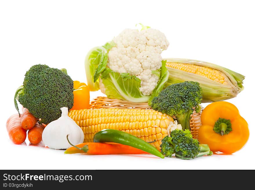 Still-life of autumn harvest with yellow, orange and green colors on isolated white background. Still-life of autumn harvest with yellow, orange and green colors on isolated white background