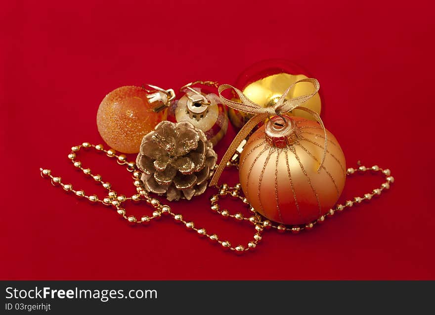 Gold Christmas decorations over red