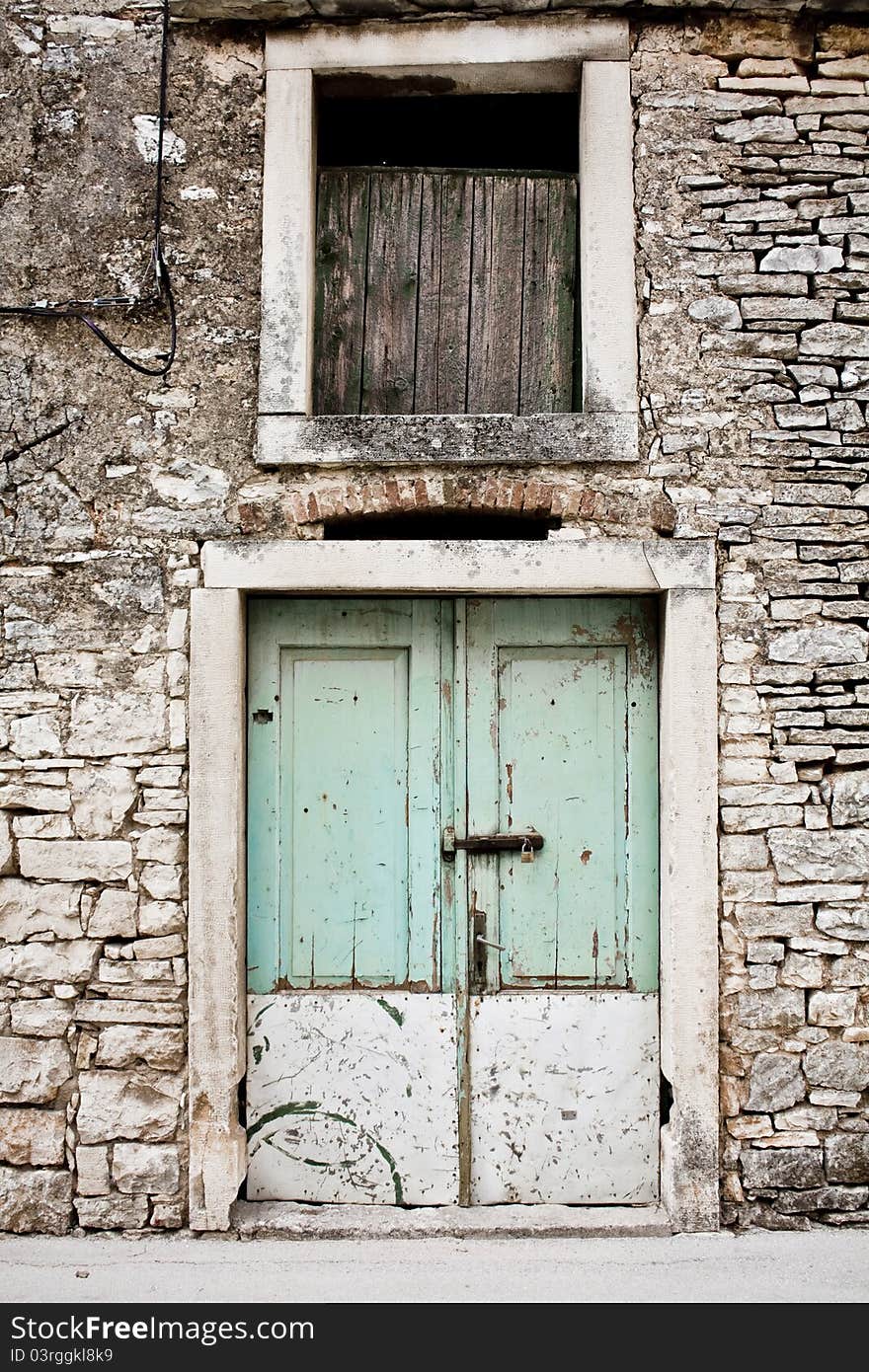 Old wooden door on a stone surface. Old wooden door on a stone surface