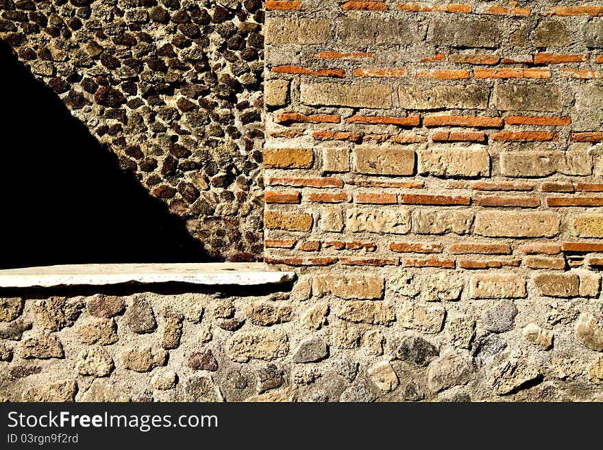 Ancient wall between the ruins of Pompeii. Ancient wall between the ruins of Pompeii