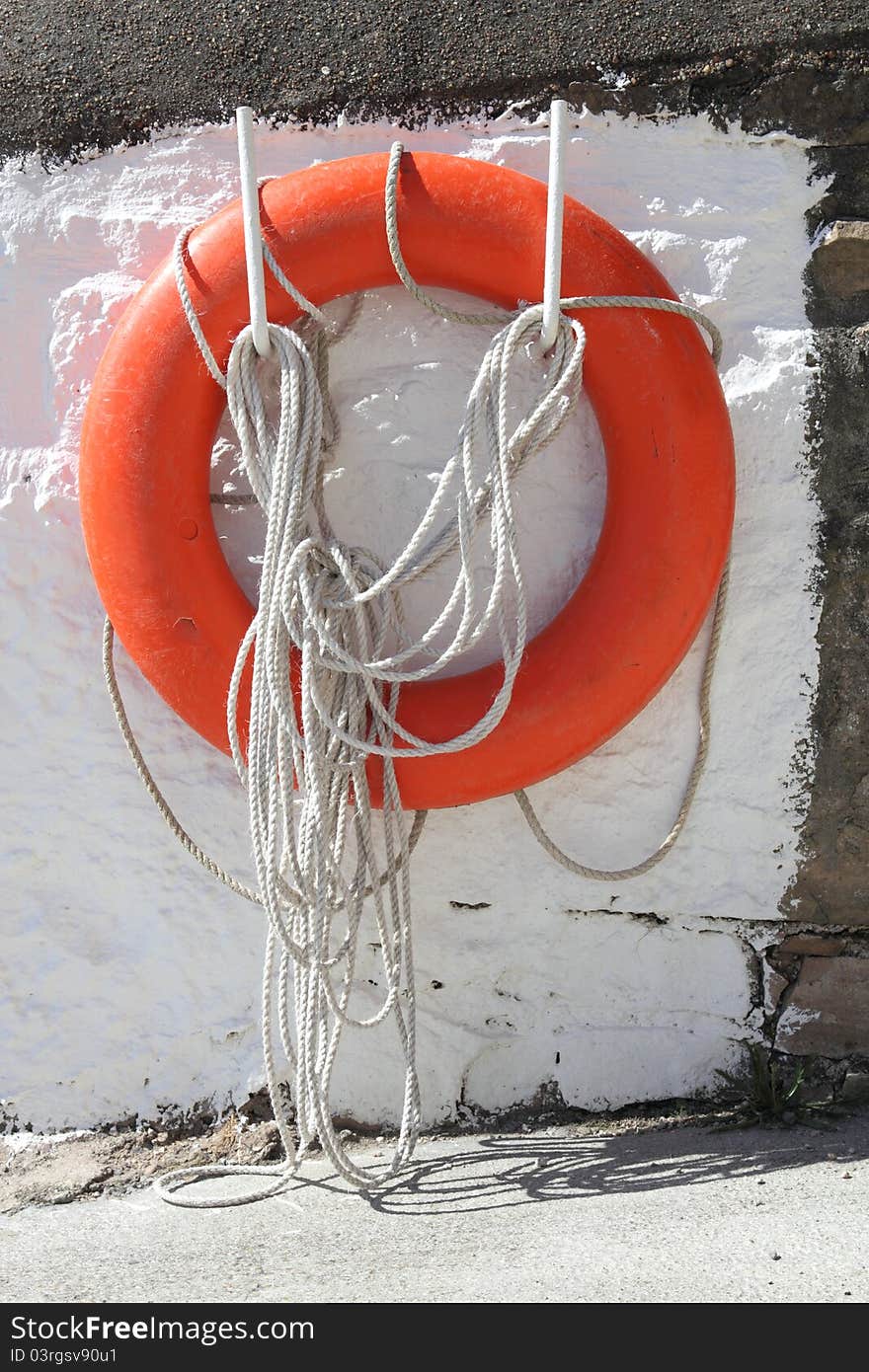 Lifebuoy on wall, Burghead pier, Moray, Scotland