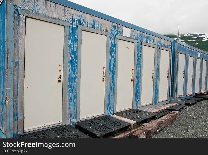 Row of old and closed wooden doors. Row of old and closed wooden doors.