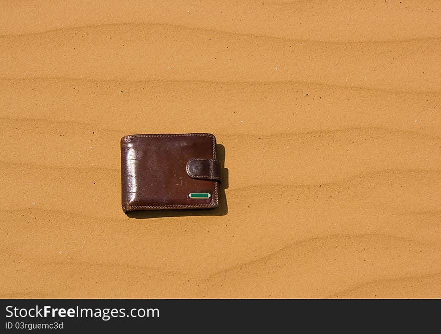 Purse lying on the ground in the desert. Purse lying on the ground in the desert