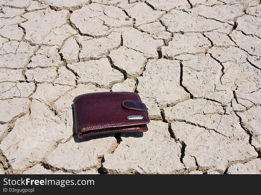 Purse lying on the ground in the desert. Purse lying on the ground in the desert