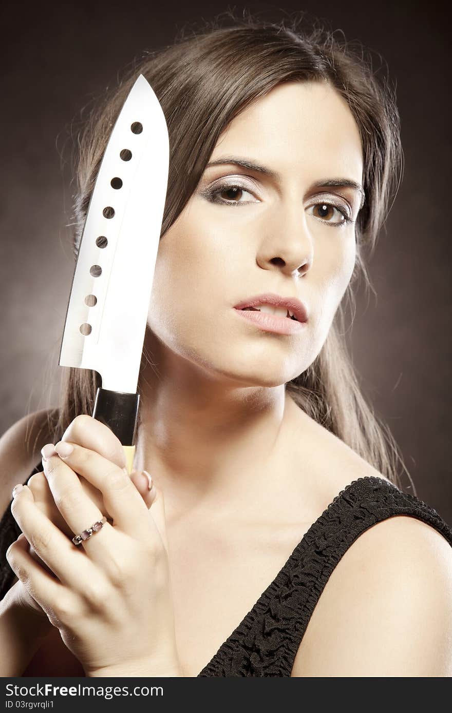 Beautiful woman with a knife