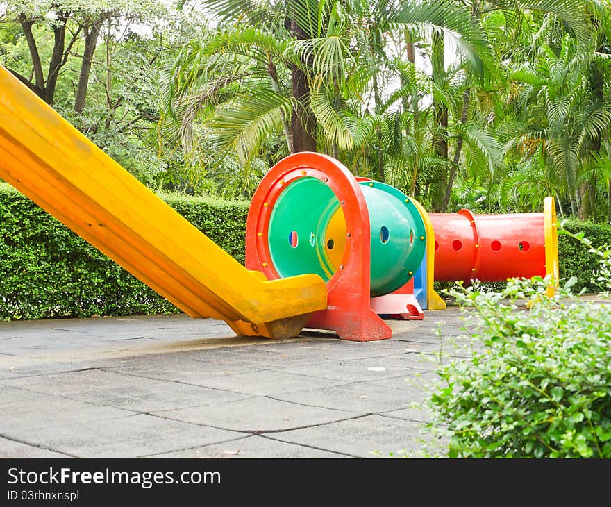 Colorful slider and tube for children in playground. Colorful slider and tube for children in playground