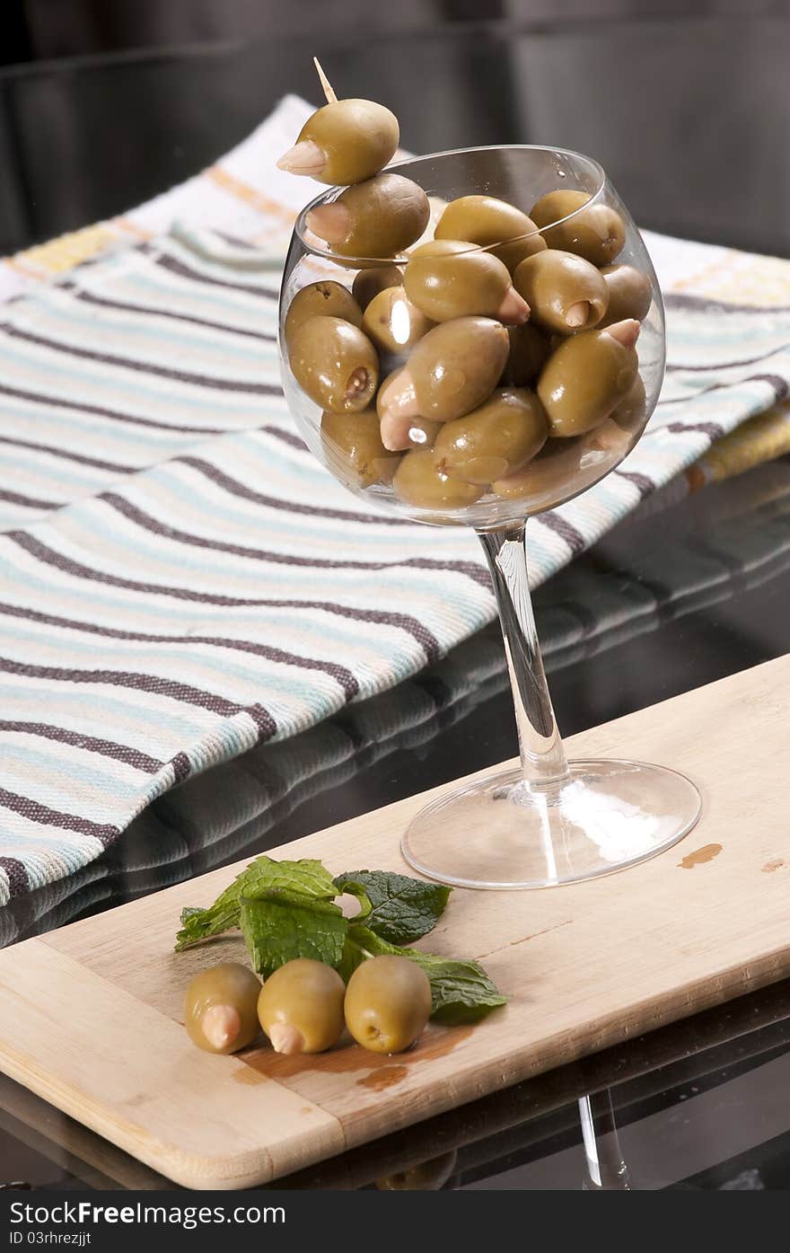 Almond stuffed olives in a wine glass