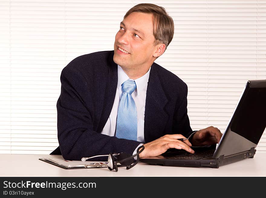 Portrait of a nice man with computer. Portrait of a nice man with computer