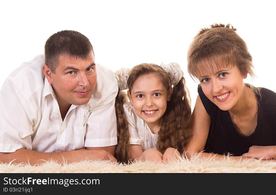 Cute family of a three lying on carpet. Cute family of a three lying on carpet