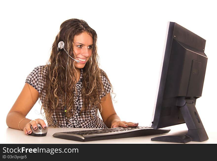 Cute girl posing at computer on white. Cute girl posing at computer on white