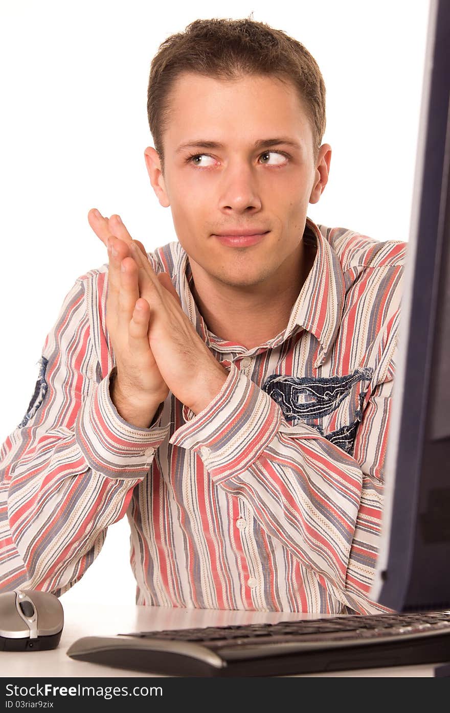 Portrait of a cute man at computer. Portrait of a cute man at computer