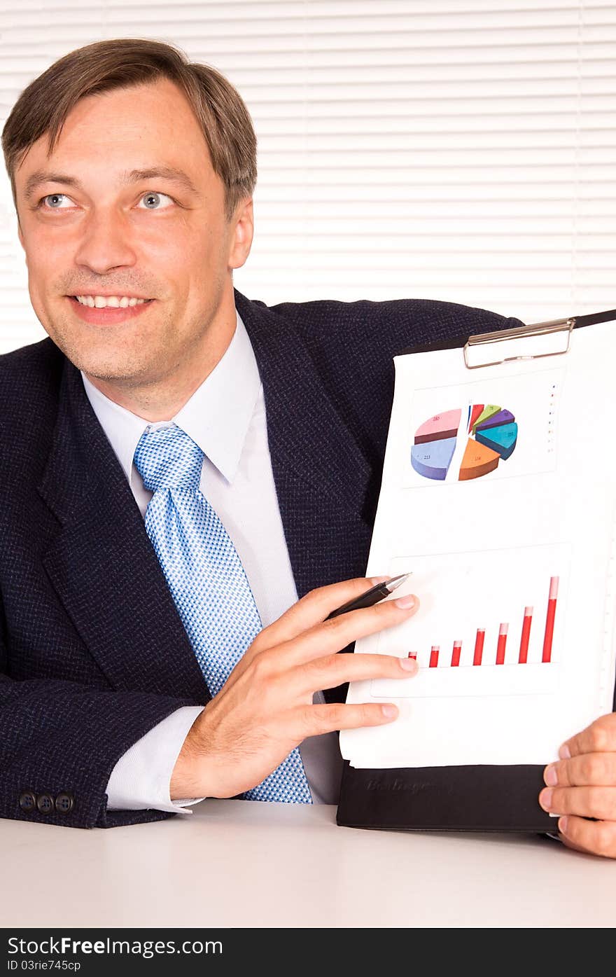 Portrait of a businessman posing at office. Portrait of a businessman posing at office