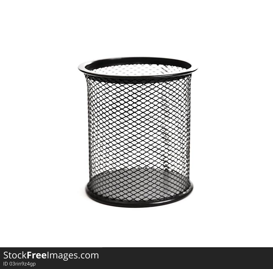 Black basket for pens on white background