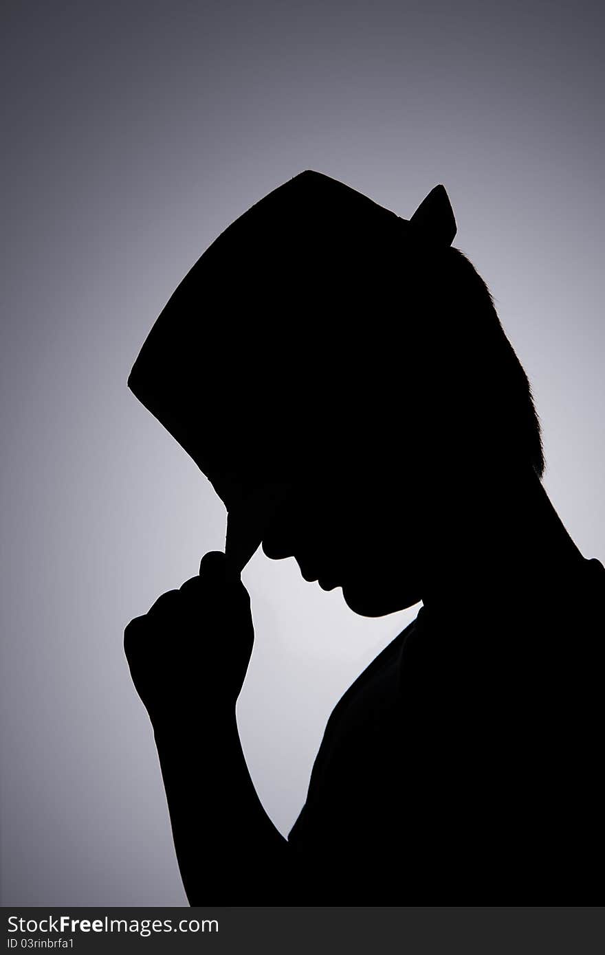 Young boy is performing with hat in backlight. Young boy is performing with hat in backlight