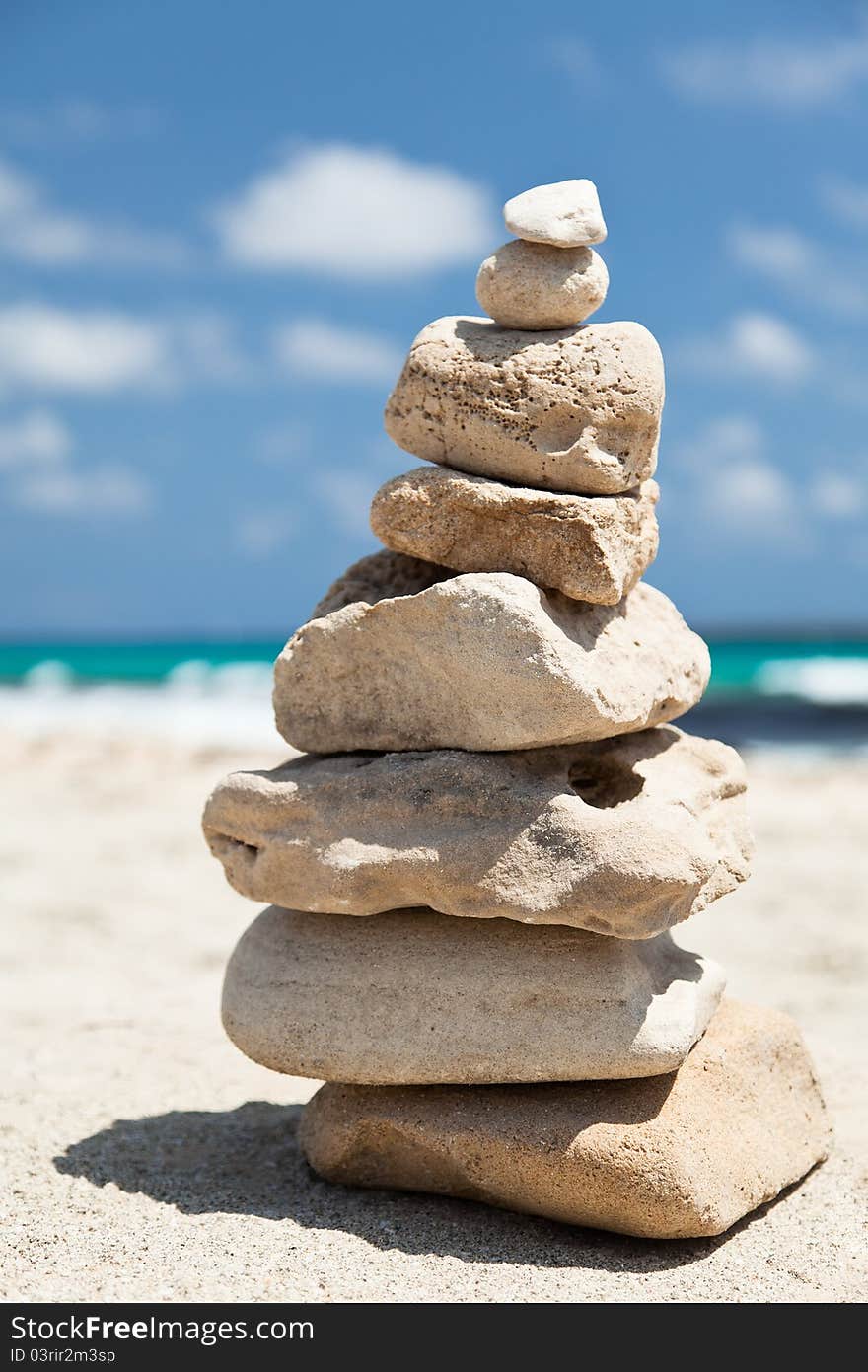 Stack Of Pebbles On The Beach.