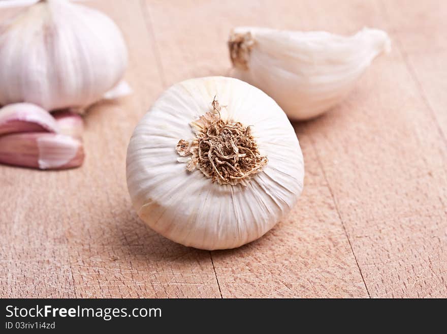 Garlic on a chopping board. Garlic on a chopping board