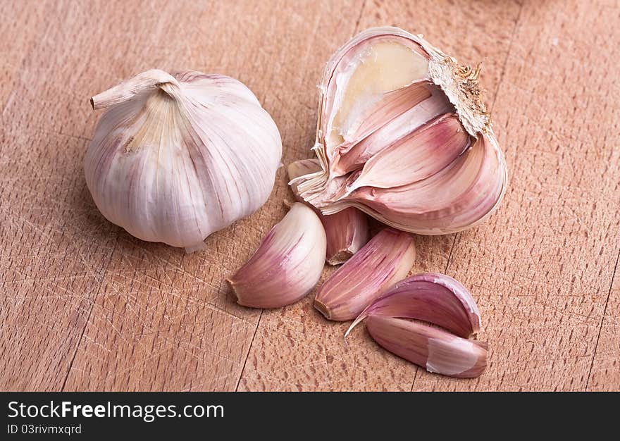 Garlic On Rough Chopping Board