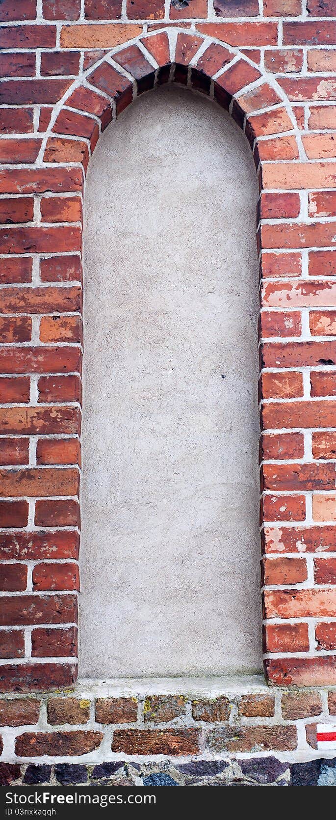 Concrete window in old wall