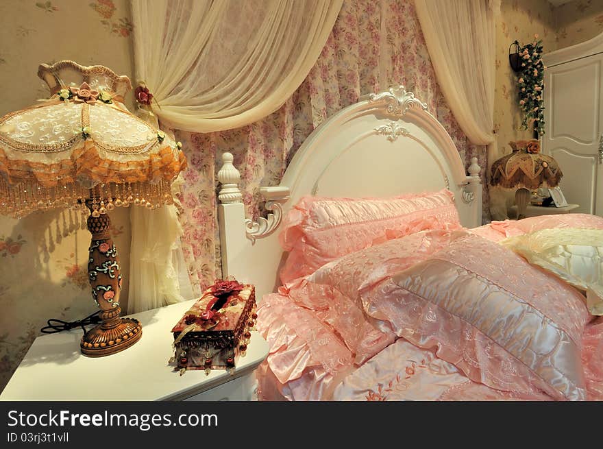 Flowery and pink color bedding and furniture in bedroom, elegance and fine style for female. Flowery and pink color bedding and furniture in bedroom, elegance and fine style for female.