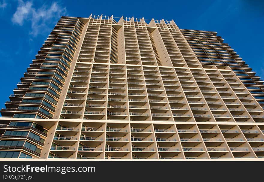 Prospective view to modern building with blue sky background