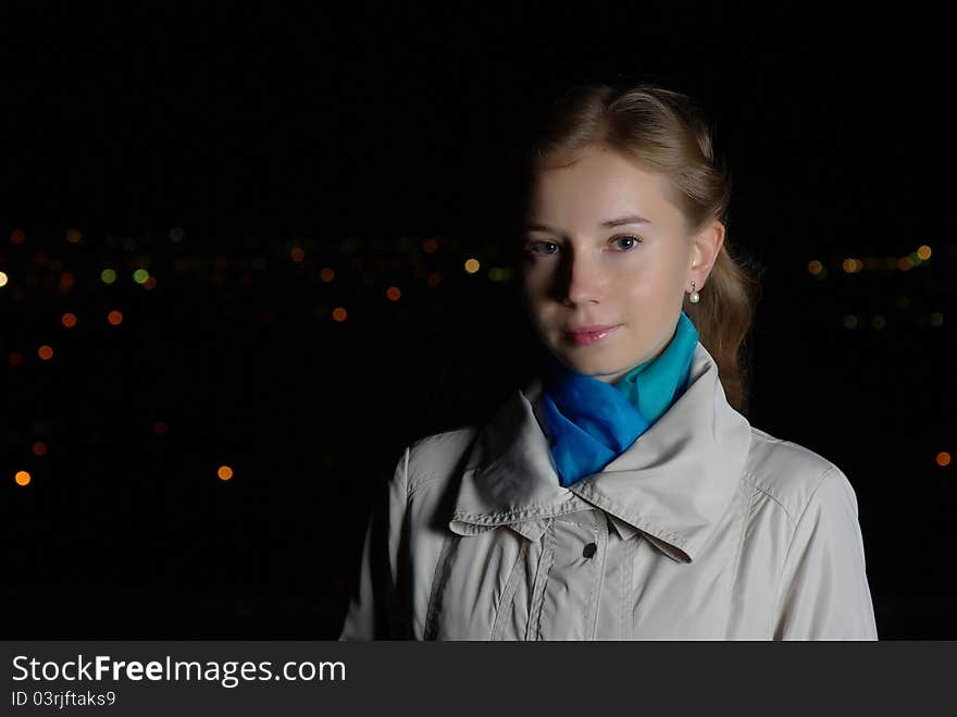 Intelligent girl in a beige coat