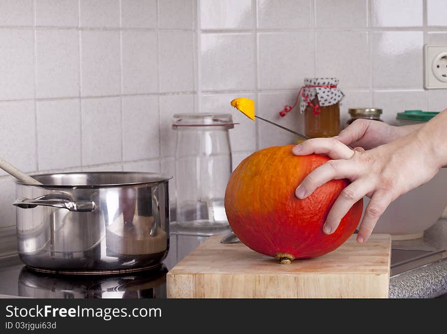 Studio-shot of preparing lunch for the family. cooking pumpkin soup in a modern kitchen. Studio-shot of preparing lunch for the family. cooking pumpkin soup in a modern kitchen.